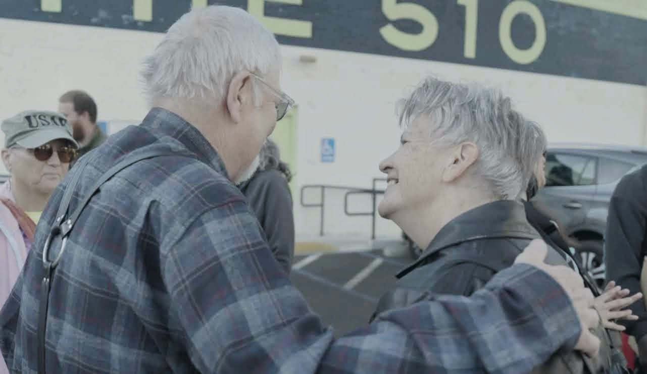 Anders Winther and Linci Comy greet one another at a Compassionate Veterans event at Root'd in the 510 Dispensary in Oakland, Calif.