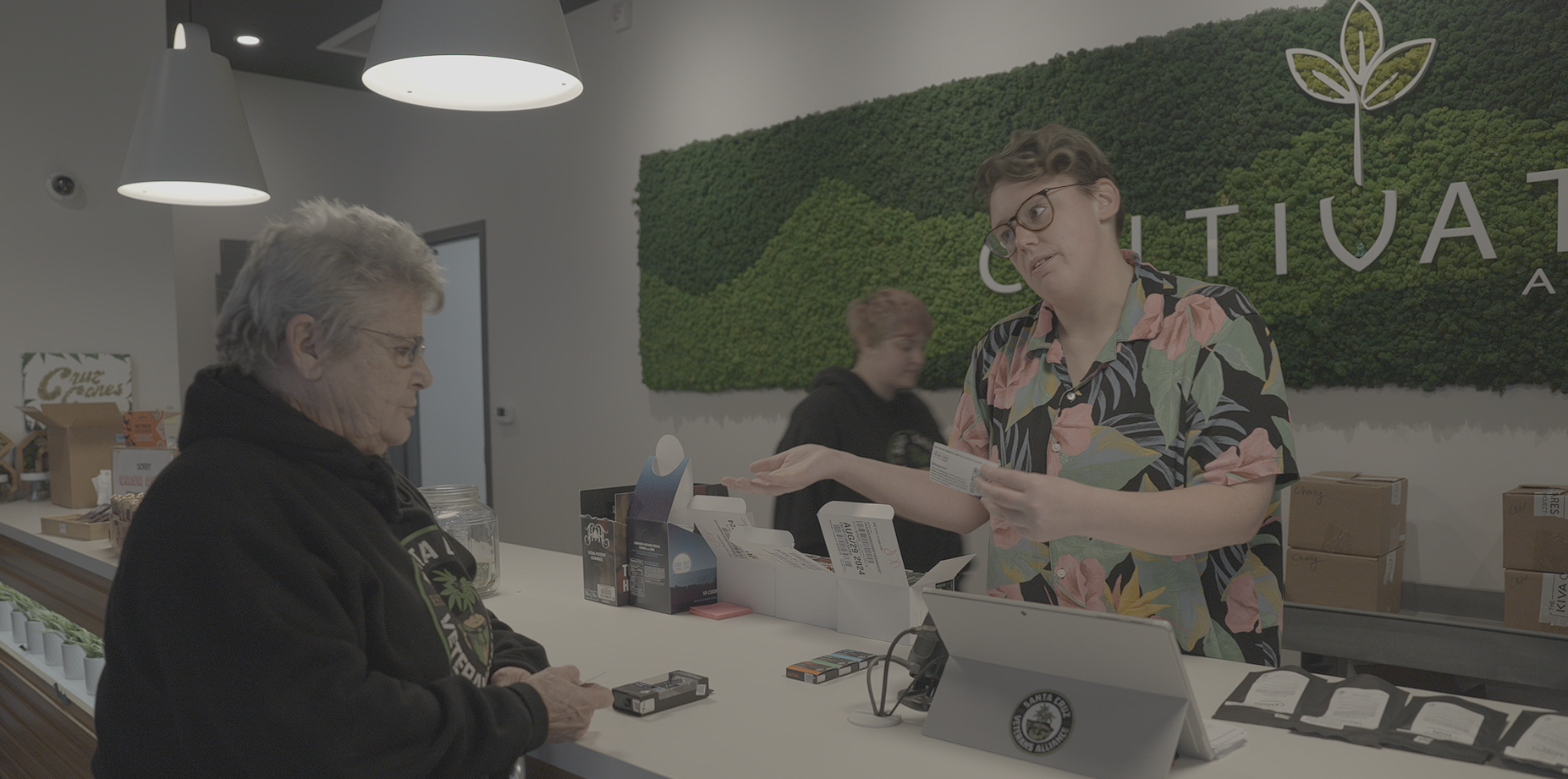 Kathleen Anderson picks up her compassion donation from Santa Cruz Veterans Alliance at Cultivate Dispensary in Aptos, Calif.